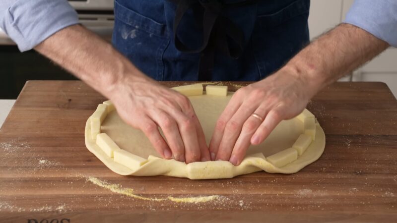 putting cheese underneath our pizza crust