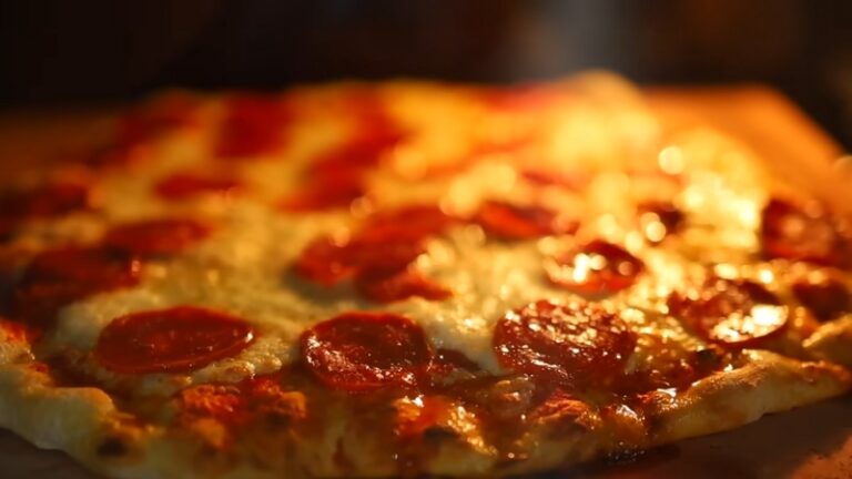 A pepperoni pizza with golden crust, showing the best temperature to bake a pizza