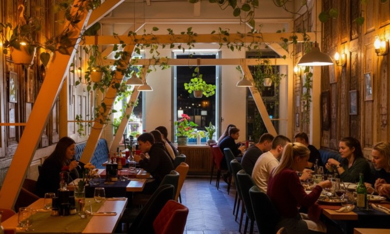 Cozy restaurant with warm lighting, filled with people dining